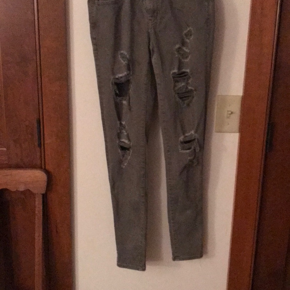 green ripped american eagle jeans